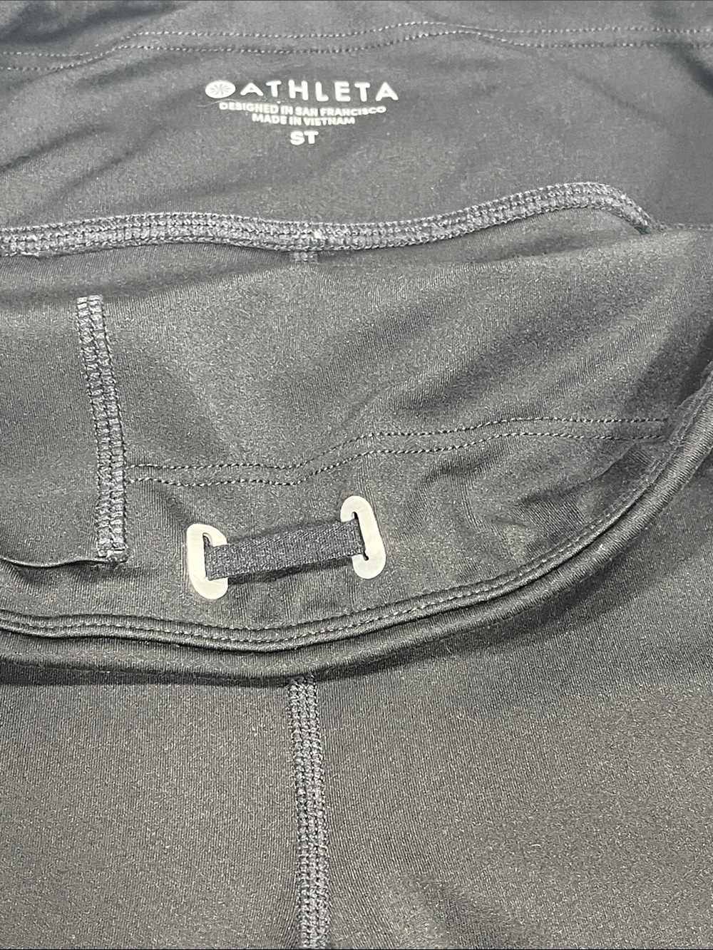 Athleta ST Black 7/8 Leggings Reflective Trim Zip Pocket Tall - Picture 3 of 8